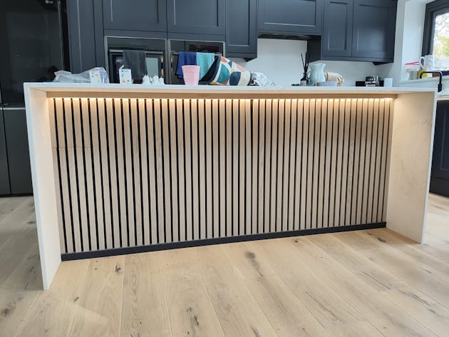 Dimmable strip lighting  on underside of the kitchen island.