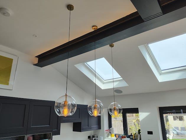 Long pendant lights over the kitchen island.