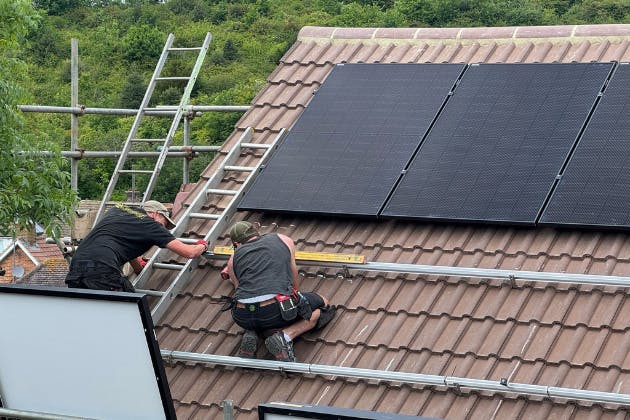 Tom & Edvin fitting solar panels Bevendean